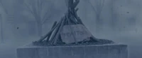 Underneath the charred corpses outside a church in Silent Hill are signs that says "traitor" in Silent Hill: Revelation.
