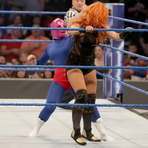 The evil Alexa as La Luchadora attacking Becky Lynch