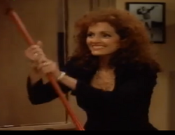 The psychotic Elaine clutching an axe