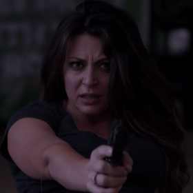 Jen holding Sean and Lisa at gunpoint