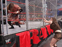 RAW 4th March 2002: Stephanie slamming the cage door into Triple H's face
