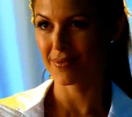 Janet smiling evilly after handing Abby the poisoned lip gloss