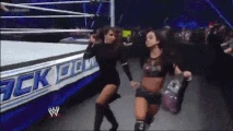 AJ Lee skipping away with the evil Layla