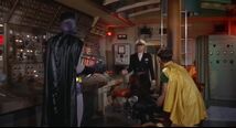 Robin orders Catwoman to get up, but they are interrupted