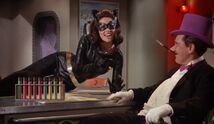 Catwoman and Penguin with the dehydrated Security Council in test tubes!