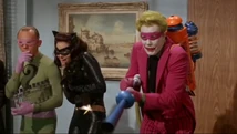 Catwoman watches as Joker vaporizes the Security Council!