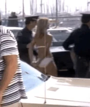 Caroline Field under arrest. Zoom gif.