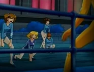 Clover and the gymnasts cornering Alex