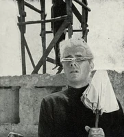 Mrs. Fothergill's dead body hangs in the background