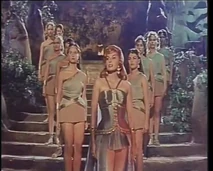 The embalmers show her their work