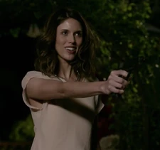 Patty pointing a gun at Rose while she is accusing her of being the killer