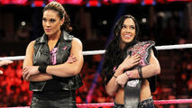 AJ Lee with her bodyguard, Tamina Snuka