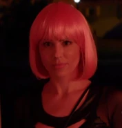 Elise in her wig while approaching Vance