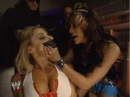 Melina forces a bound and gagged Trish Stratus to accept a match for the WWE Women's Championship
