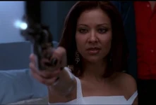 Gala pointing her gun at Escobar