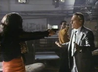 Niles held at gunpoint, as Elena tells him how wet his death will make her
