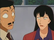 Keiko, suspicious of Kogoro, glared at him