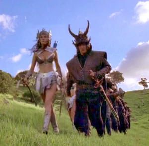 Leads band of mercenaries & archers