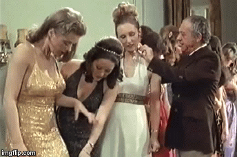 Margaret Nolan gold dress.gif