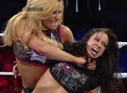 Natalya sadistically choking AJ Lee