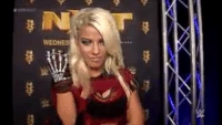 The evil Alexa backstage smiling wickedly