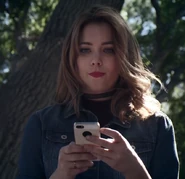 Chloe with Blake's phone