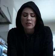 Elise in her hooded disguise while killing Becky