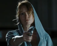 Rosalyn pointing her gun at Nick Blades following her reveal