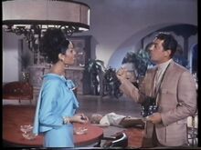 Evil Barbara's corpse on the floor as Tina and Helm chat (Nancy Kovack with Daliah Lavi and Dean Martin) (Large)