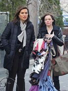 Benson talking to Cassandra while the latter is shopping