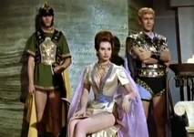 Phaedra in open-side dress