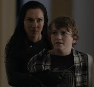 Victoria holding Jacob hostage