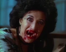 Marie flashing her blood-covered fangs