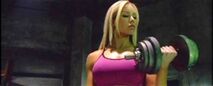 Nina curling heavy dumbbells and intimidating her opponents