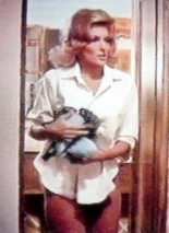 What evil lurks below Barbara's shirt, only the shadow knows.