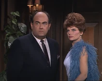 Tracy is shocked and dismayed to find Smart alive and pointing a gun at her.