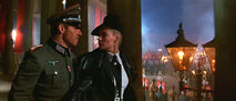 Indy Jones in Nazi disguise, confronts Elsa at a Nazi rally in Berlin.