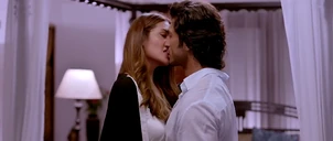 She kisses him telling him she's willing to go further for her husband and leaves.