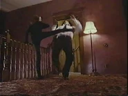 Dara doing one of her high-kicks on Michael