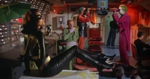 Catwoman reclines aboard the submarine on the way to the United World building