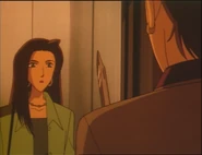 Eiko armed with a knife, preparing to murder Mika