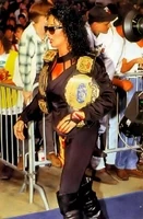 Sister Sherri on her way to the ring with Harlem Heat's WCW tag team titles