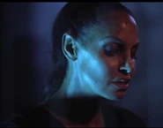 The evil Gina looking down at Scott