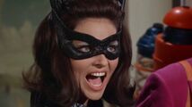 "Miss Kitka dies if you take one more step!" Catwoman threatens Batman