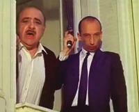 Sheriek and his gunman prepare to dispose of Corale.