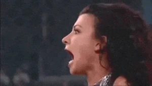 The evil Tara shrieking and scowling at Angelina Love