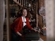 Jackie preparing to leave with the money