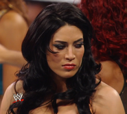 Melina giving an ominous glare at Natalya