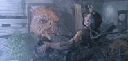 The Kandarian Demon uses it's tree branch fingers to grab Ash Williams.