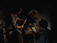 Scotty and Ash find Professor Knowby's belongings in the fruit cellar.